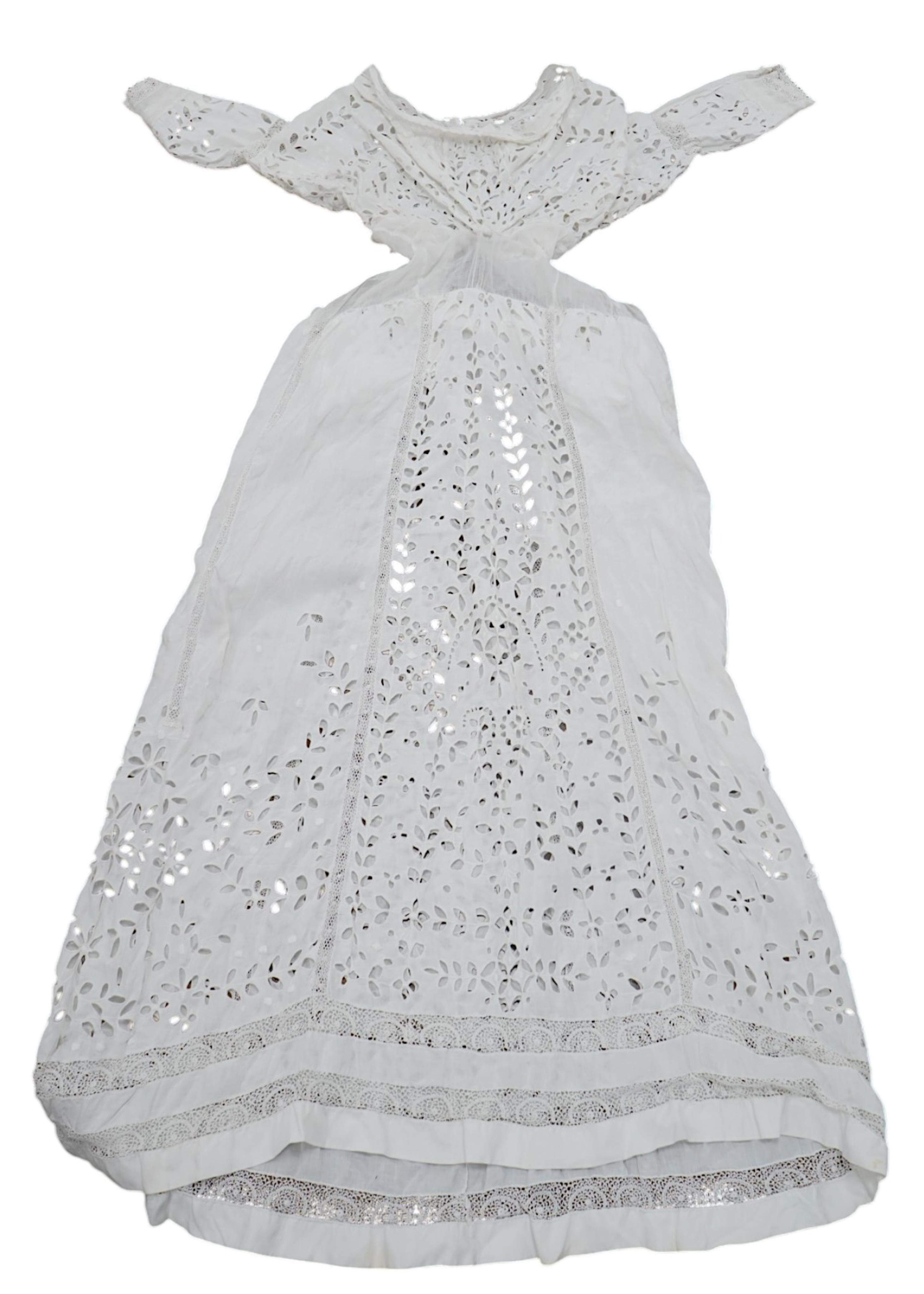 An Edwardian fine white embroidery anglaise and Irish crochet trimmed ladies summer dress, designed with large panels of anglaise cut work, the dress has been altered and restyled, which could be altered back, 134cm long